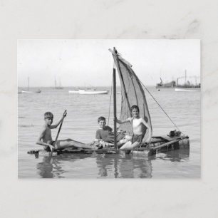 Boys on a makeshift raft. Vintage photograph Postcard