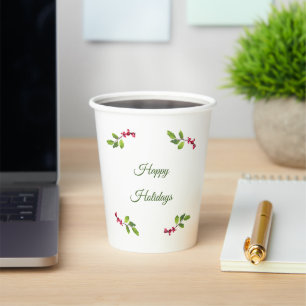 Brach of holly berries and leaves paper cups