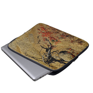 BRANCH AND RED SPRING FLOWERS IN THE DESERT LAPTOP SLEEVE