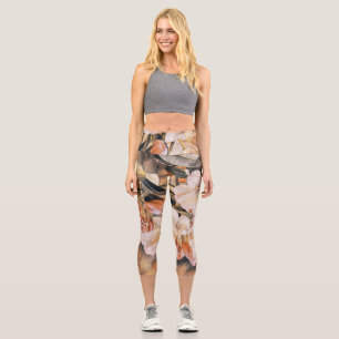 Branch with an orange spring azalea flower  capri leggings