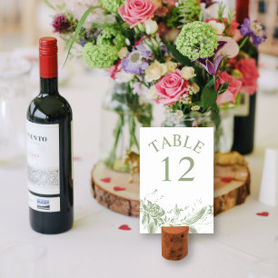 Branch with sage green and white flowers wedding table number