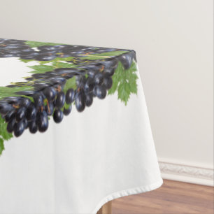 Branches of Red Wine Grapes on White Tablecloth