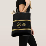Bride black gold elgant bold wedding tote bag<br><div class="desc">Two faux gold ribbons,  with the word: Bride in a hand lettered style script,  golden letters.  Elegant and timeless black background colour.</div>