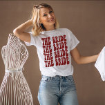 Bride Dark Red Customised Matching Bridal Party T-Shirt<br><div class="desc">Are you looking for a unique and fun way to celebrate your bachelorette party? Why not go with a personalised t-shirt theme? With our retro The Bride personalised dark red t-shirt, you can have all of your bridal party matched up in style! Not only will this shirt be a great...</div>