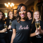 Bride Light Pink Script Black Wedding T-Shirt<br><div class="desc">Simple and chic black tee shirt with light pink script "bride" design. Makes a great wedding gift!</div>