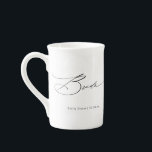 Bride Modern Elegant Script Wedding Custom Name Bone China Mug<br><div class="desc">Bride Modern Elegant Script Typography Wedding Custom Name Tea Coffee Mug features the simple text "Bride" in an elegant modern black calligraphy script typography. Personalised with your custom name and wedding date. Perfect for the bride for a bridal shower or wedding day. Designed by Evco Studio www.zazzle.com/store/evcostudio</div>