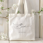 Bride Modern Elegant Script Wedding Custom Name Tote Bag<br><div class="desc">Bride Modern Elegant Script Typography Wedding Custom Name Tote Bag features the simple text "Bride" in an elegant modern black calligraphy script typography. Personalised with your custom name and wedding date. Perfect for the bride for a bridal shower or wedding day. Designed by Evco Studio www.zazzle.com/store/evcostudio</div>