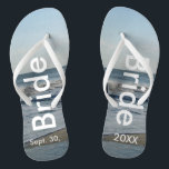 Bride Ocean Waves Beach Sand Jandals<br><div class="desc">Pretty Blue Sky with Light Fluffy White Clouds, Blue Sea, Crashing Ocean Waves and Beach Sand. Unisex Flip Flops with Bride and Date of Marriage written in a white text. PERSONALIZE with your Wedding DATE (or delete text). The wedding date is written in the sand. Choose wide or slim straps...</div>