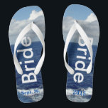 Bride Ocean Waves Blue Sky Jandals<br><div class="desc">One-of-a-kind Bride flip flops custom designed. Pretty Blue Sky with Fluffy White Clouds, Blue Sea and White Foam Ocean Waves. Unisex Flip Flops with Bride written in a light silver text, and Date of Marriage in blue text. PERSONALIZE with your Wedding DATE (or delete text). Shown with Wide White Straps...</div>