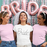 Bride Personalised Bachelorette | Custom Name T-Shirt<br><div class="desc">Make the bride-to-be shine with this chic and personalised "Bride" T-shirt, featuring elegant script with a sweet heart detail and her name underneath. Perfect for bachelorette parties, bridal showers, wedding weekends, or as a fun getting-ready outfit. Comfortable, stylish, and totally Insta-worthy, this custom tee is a must-have for any modern...</div>