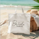 Bride Personalised Bachelorette | Custom Name Tote Bag<br><div class="desc">Celebrate the bride in style with this elegant and minimal Bride tote bag, personalised with her name underneath a modern script and heart design. It’s the perfect carry-all for bachelorette party favours, bridal shower essentials, or a thoughtful gift for the future Mrs. Lightweight yet sturdy, this cotton tote is ideal...</div>