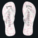 Bridesmaid Beach Wedding | Floral White Lace Pink Jandals<br><div class="desc">Personalised, romantic floral lace beach wedding flip flop sandals- Faux vintage style, floral white lace on feminine pink background. Name of bridesmaid at top in curved, elegant style, script letters. Bridesmaid is printed down the middle in modern lettering. Change to fit bridal party members, such as bride, flower girl or...</div>