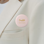 Bridesmaid blush pink name tag 6 cm round badge<br><div class="desc">A blush pink background colour.  Personalise and add your bridesmaid's name.  Golden handwritten style script.</div>