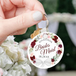 Bridesmaid Elegant Red Floral Wreath Wedding Key Ring<br><div class="desc">These keychains are designed to give as favours to bridesmaids in your wedding party. They feature a rustic hand painted watercolor design with a wreath of roses and flowers in shades of red, burgundy, and blush pink. The text is written in elegant script letters, and there is room for her...</div>