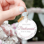 Bridesmaid Elegant Wedding Gift Dusty Rose Key Ring<br><div class="desc">These keychains are designed to give as favors to bridesmaids in your wedding party. They feature a simple yet elegant design with a white background, dusty rose or mauve pink & Gray text, and a silver faux foil floral border. Perfect way to thank your bridesmaids for being a part of...</div>