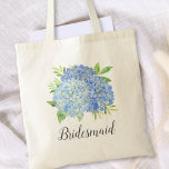 Bridesmaid Floral Blue Hydrangea Foliage Tote Bag<br><div class="desc">This bridesmaid tote bag features a watercolor blue hydrangea and green foliage design. You can personalise it with a name. Please visit our store or our collection pages for more products featuring this design that you can customise for your needs.</div>