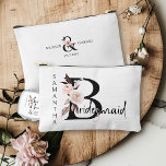 Bridesmaid Flower Letter Boho Floral Personalised<br><div class="desc">Bridesmaid accessory bag to personalise for your bridesmaid. Bridesmaid is lettered with neutral boho floral letters and handwritten script. You can also add the name of the bride and groom and their wedding date, which frames a co-ordinating floral ampersand. Lovely wedding party keepsake gift and perfect for a fall wedding,...</div>