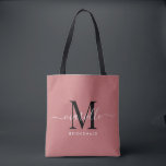 Bridesmaid Gift Black White Monogram Dusty Rose Tote Bag<br><div class="desc">This Bridesmaid tote bag features a handwritten white and black script typography monogram with swashes on a dusty rose background. Present your bridesmaids with a tote for carrying items the day of the wedding,  and traditionally presented at the rehearsal dinner or before.</div>