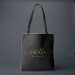Bridesmaid | Modern Minimalist Script Bachelorette Tote Bag<br><div class="desc">This Bridesmaid accessory bag features a handwritten gold script typography with swashes on a black background. Present your bridesmaids with a tote bag for small items traditionally presented at the rehearsal dinner,  for use in the early morning before the wedding.</div>