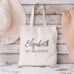 Bridesmaid Modern Minimalist Script Bachelorette Tote Bag<br><div class="desc">Elevate your bachelorette party with our "Bridesmaid Modern Minimalist Script" collection. This exquisite line of products embodies contemporary elegance and timeless style, perfect for celebrating your upcoming nuptials in a modern and sophisticated way. Our minimalist script design places your bridesmaids at the forefront, adding a touch of class to every...</div>
