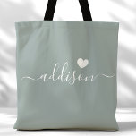 Bridesmaid Modern Script Heart Sage Green Tote Bag<br><div class="desc">This chic tote bag features a beautiful Sage Green background adorned with a modern script font and a delicate heart design. The soft, elegant colour and sophisticated typography make it an ideal accessory for bridesmaids or anyone who loves stylish and trendy designs. Perfect for carrying essentials, this tote bag adds...</div>