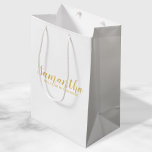 Bridesmaid Proposal | Modern Script Gold Medium Gift Bag<br><div class="desc">Bridesmaid Proposal | Modern Script White and Gold Gift Bag featuring personalised bridesmaid's name in gold modern script font style on white background. Also perfect for maid of honour, flower girl, groomsman, best man and ring bearer. Please Note: The foil details are simulated in the artwork. No actual foil will...</div>