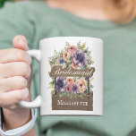 Bridesmaid Rustic Floral Colourful Watercolor Gift Coffee Mug<br><div class="desc">Celebrate your bridesmaids with this beautiful and personalised "Bridesmaid Rustic Floral Colourful Watercolor Gift coffee mug", a perfect keepsake gift! Featuring a charming rustic floral watercolor design, the "Bridesmaid" logo text is surrounded by vibrant, colourful flowers. The design extends onto a hanging sign where you can personalise the bridesmaid's name...</div>
