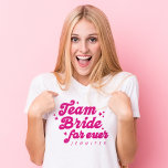 Bridesmaid Team Bride Pink Bachelorette T-Shirt<br><div class="desc">The Bridesmaid Team Bride Pink Bachelorette T-Shirt is a fun and retro-inspired essential for your bride squad. Featuring a playful pink script with "Team Bride Forever, " this shirt can be personalised with each bridesmaid's name, making it the perfect wedding party gift. Ideal for bachelorette parties, this stylish and cheerful...</div>