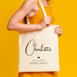 Bridesmaid Wedding Simple Modern Script Name Tote Bag<br><div class="desc">Bridesmaid Wedding Simple Modern Calligraphy Script Personalised Name Tote Bags features your bridesmaid's name in elegant black calligraphy script accented with a simple love heart with the addition of your custom text such as the date and bridemaid. Text and heart colours can be adjusted in the editor to suit your...</div>