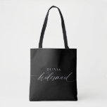 Bridesmaid's Gift Wedding Party Modern Minimalist Tote Bag<br><div class="desc">Elevate the art of gifting with our Personalised Bridesmaid Tote Bag – a timeless expression of appreciation and a symbol of cherished moments. Crafted with simplicity and elegance, this tote bag boasts modern romantic calligraphy that spells out "Bridesmaid" in exquisite white script, tailored to perfection. Black and white converge in...</div>