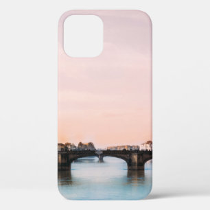 BRIDGE CROSSING RIVER IN TOWN UNDER CLOUDY SKY iPhone 12 CASE