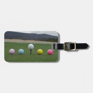 bright coloured Golf Balls on a mountain Luggage Tag