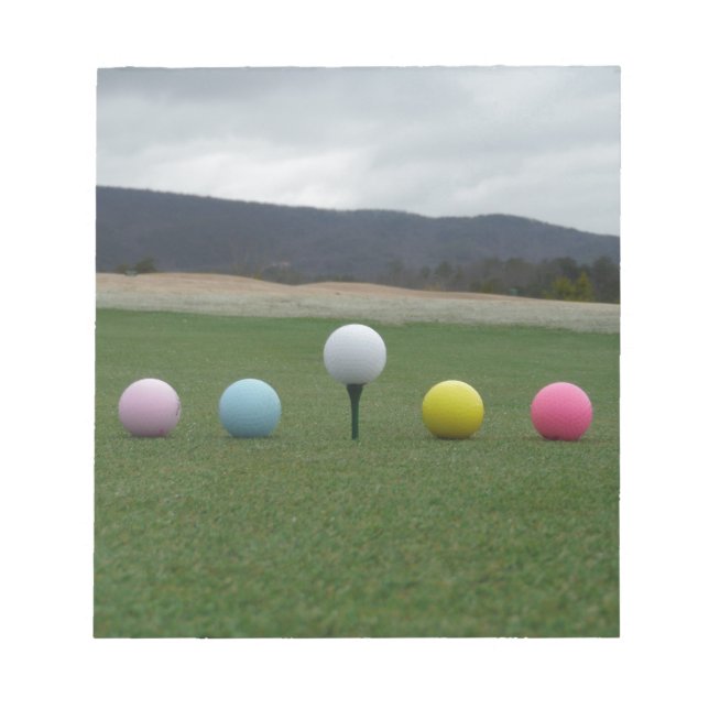 bright coloured Golf Balls on a mountain Notepad (Front)