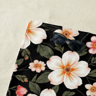 Bright floral pattern on black beach towel