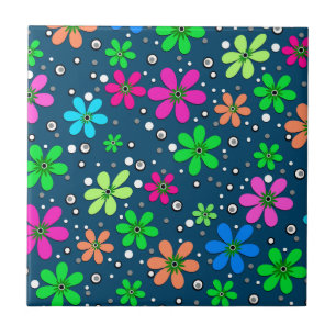 Bright multi-coloured chamomile flowers on a blue  tile