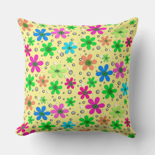 Bright multi-coloured chamomile flowers on a yello cushion