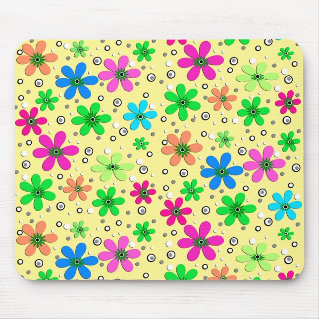 Bright multi-coloured chamomile flowers on a yello mouse pad (Front)