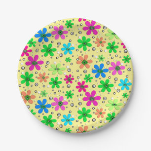 Bright multi-coloured chamomile flowers on a yello paper plate