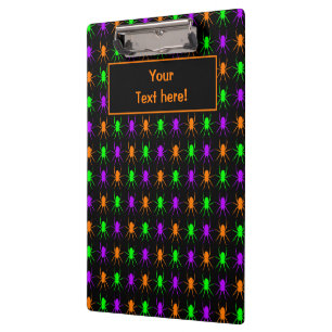 Bright multi spiders on black clipboard