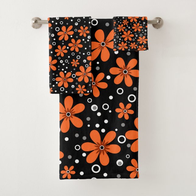 Bright orange flowers on a black background with w bath towel set (Insitu)