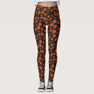 Bright orange flowers on a black background with w leggings