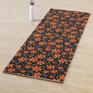 Bright orange flowers on a black background with w yoga mat