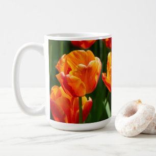 Bright orange tulips in the park coffee mug