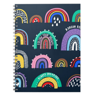 Bright rainbows on a dark background. Cute illustr Notebook