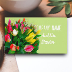 bright red and yellow tulips on spring green business card