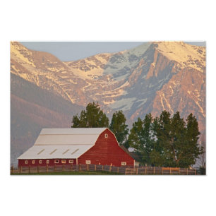 Bright red barn against Mission Mountains in Photo Print