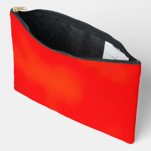 Bright red zippered pouch on a white background