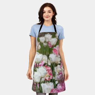 Bright white and pink tulips on a sunny day apron