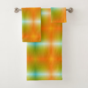 Brightly coloured towels hang on a silver bar