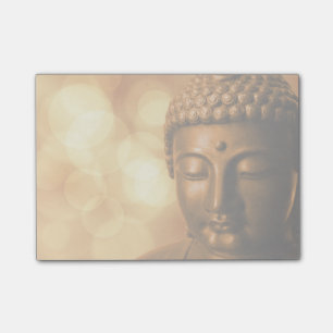 Bronze Buddha Statue with Golden Bokeh Background Post-it Notes